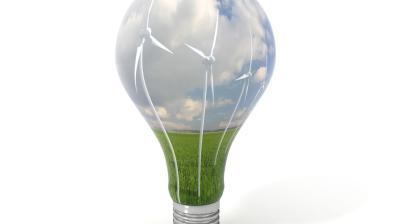 A light bulb with wind turbines in it.